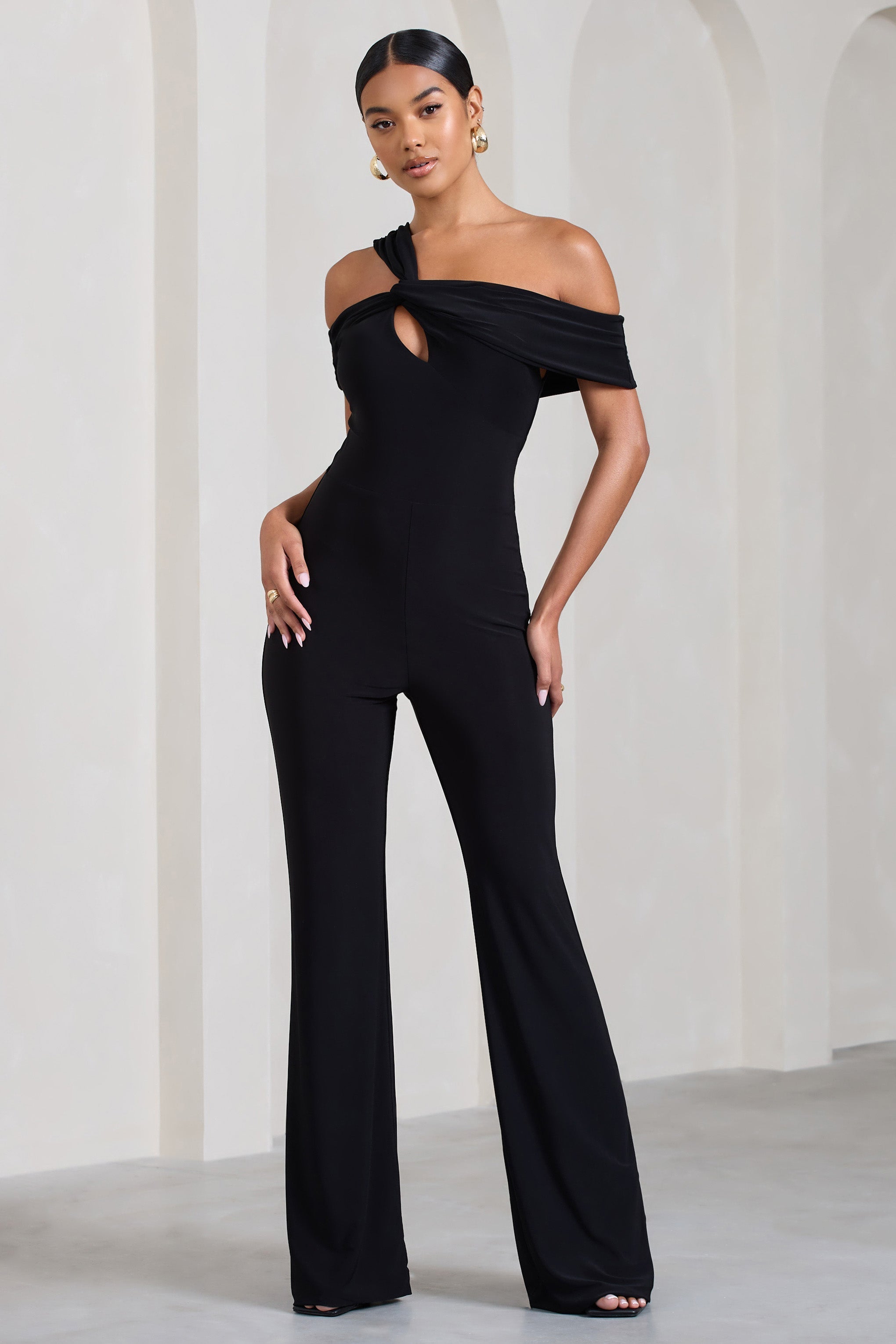 Striking Black Strappy Asymmetric Flared-Leg Jumpsuit