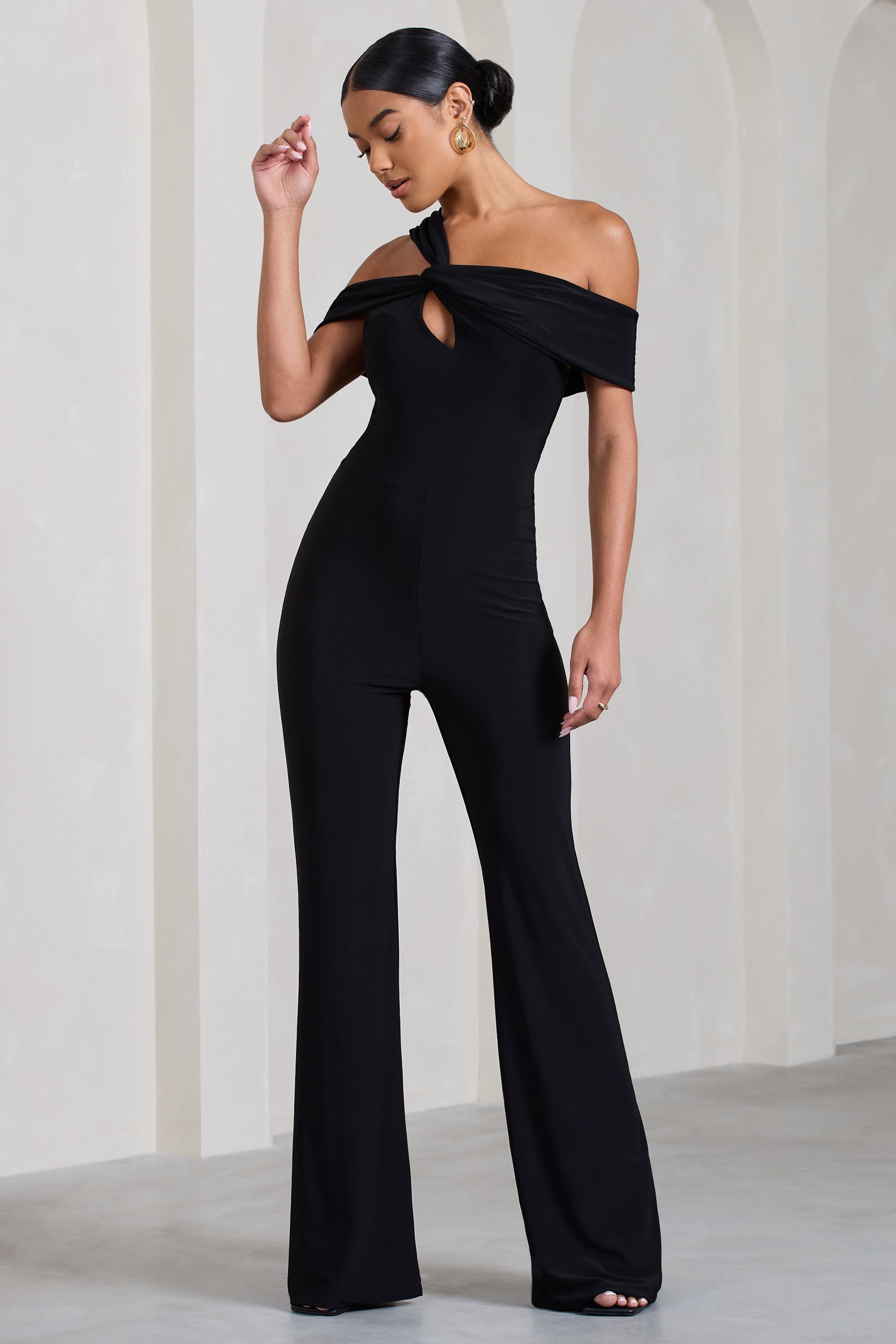 Striking Black Strappy Asymmetric Flared-Leg Jumpsuit