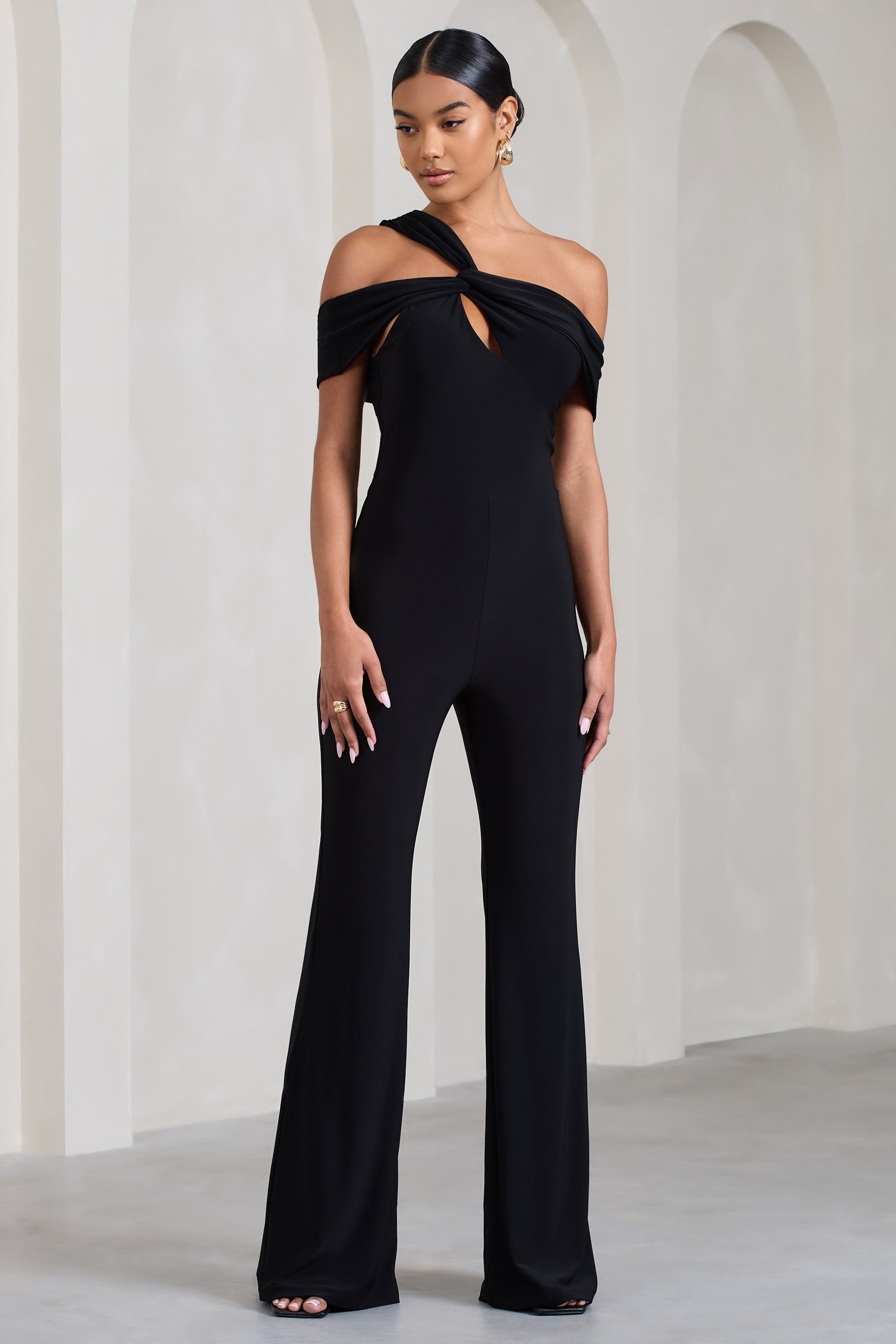 Striking Black Strappy Asymmetric Flared-Leg Jumpsuit