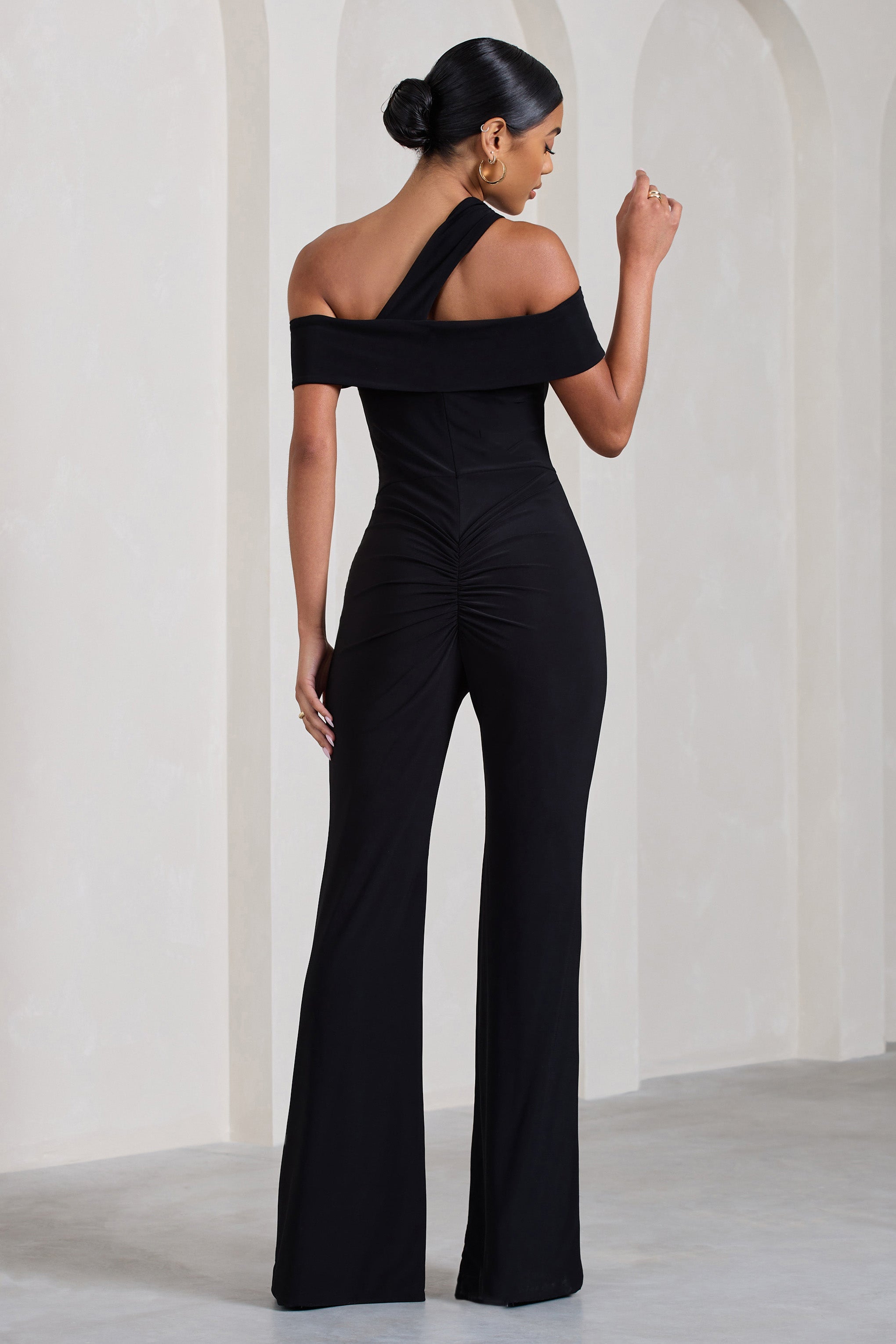 Striking Black Strappy Asymmetric Flared-Leg Jumpsuit